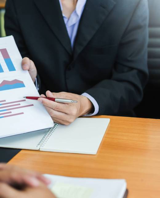 Business people meeting together about investment and the discussion graph financial information at the meeting.